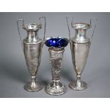 A pair of silver twin-handled flute vases on weighted bases, Joseph Gloster Ltd, Birmingham 1923 (