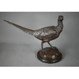 A brown-patinated bronze cock-pheasant, unsigned, on circular stone base, 45 x 33 cm overall