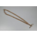 A graduated 9ct rose gold Albert chain with two swivels and bar attached, 41 cm long (open) and