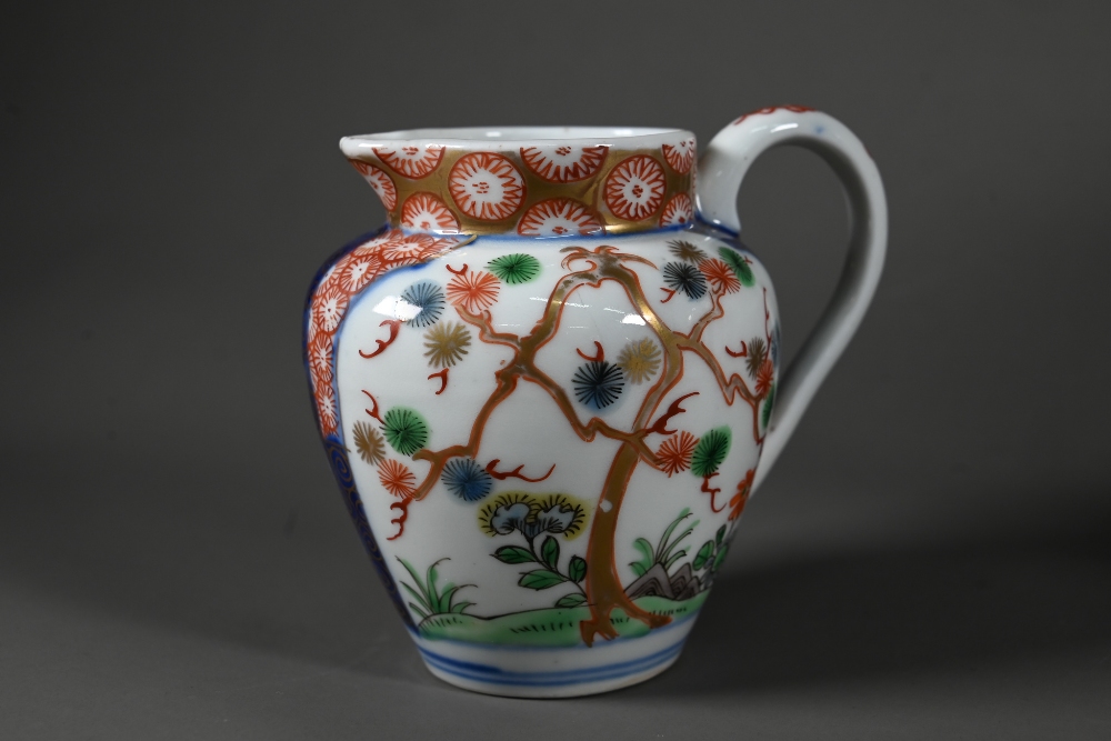 A Japanese Arita Imari teapot, milk jug and sugar bowl with Aoki Bothers marks, painted in - Image 23 of 25