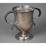 A George III silver loving cup with twin scroll handles on plain stem and domed foot, Charles