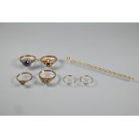 Four various stone set 9ct yellow gold rings, a pair of sleeper earrings and a delicate fancy link
