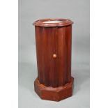 A Victorian marble top mahogany cylinder pot cupboard, the fluted sides and door raised on a