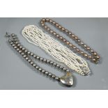 A choker-style necklace formed of six rows of river pearls on to white metal paste-set rectangular