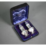 An Edwardian cased pair of octagonal baluster pepperettes, Deakin & Francis, Birmingham 1902, 1.8oz,