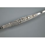 An Edwardian-style diamond set bracelet, yellow and white metal set stamped 18ct featuring elongated