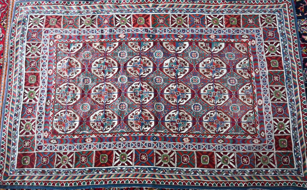 A North Indian Kashmiri Turkoman design chain-stitched rug or wall hanging, embroidered in