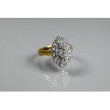 A marquise-diamond cluster ring, the three central diamonds surrounded by fourteen smaller diamonds,