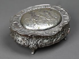 German .800 grade oval trinket box with embossed and chased decoration, on three scroll feet, 4oz,