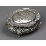 German .800 grade oval trinket box with embossed and chased decoration, on three scroll feet, 4oz,
