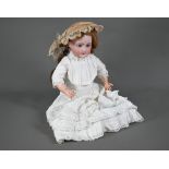 A French SFBJ 391 bisque-headed girl doll with closing blue eyes and open mouth with four teeth,