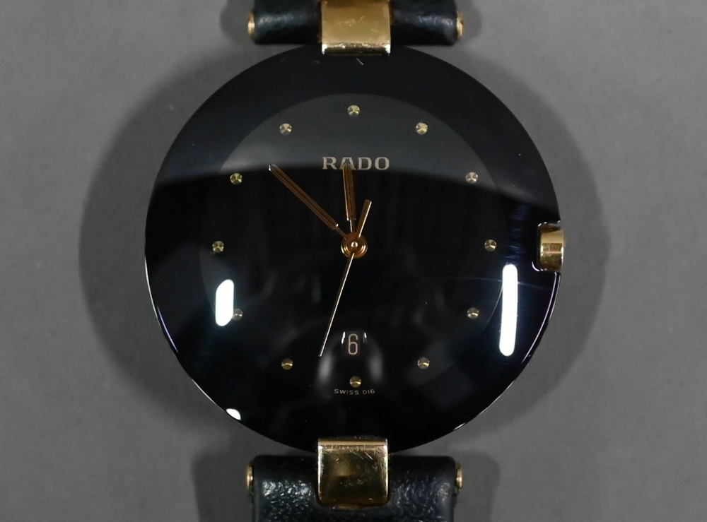 WITHDRAWN A Rado Dia Star wristwatch, black dial and gilt, with black leather strap, - Image 5 of 6