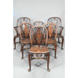 A set of six oak and elm hoop and Windsor dining chairs, raised on crinoline stretchers,