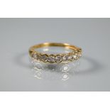 A diamond set half eternity ring, the ten collet set diamonds within 18ct yellow gold band, diamonds