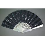 Yvonne Renouf-Smith: a silver fan, the black silk leaf decorated with foil polka-dots, London