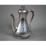 A Victorian engraved silver pear-shaped coffee pot with engraved decoration, ebonised finial and