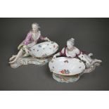 A pair of 19th century Meissen bonbon dishes modelled as floral painted and encrusted baskets held