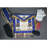 A set of Masonic regalia (Middlesex) including apron, cuffs, gilt and enamelled jewels etc