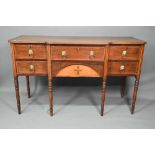 A late 19th century Sheraton design mahogany breakfront sideboard, with an arrangement of six