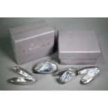 Four electroplated mussel-eaters of naturalistic form, in presentation boxes
