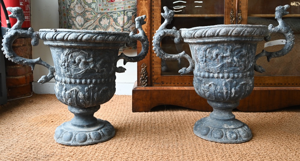 A pair of antique classical style lead urns, with dragon handles, 56 cm h (2) original, bodies