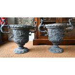 A pair of antique classical style lead urns, with dragon handles, 56 cm h (2) original, bodies
