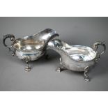 A matched pair of late Victorian silver sauce boats in the Georgian manner, with gadrooned rims,