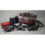 An Olympus OM-1 SLR camera no 574413 - black bodied, and another no 630744 - silver, G Zviko Auto-