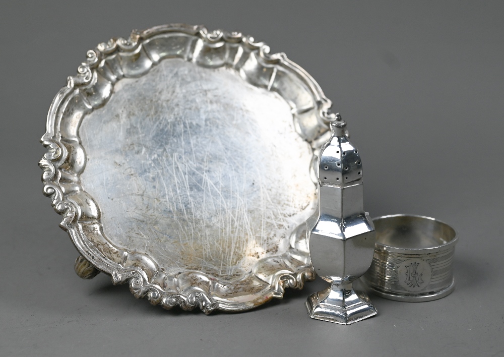 A Victorian silver card salver in the Georgian taste, with moulded rim and three scroll feet,