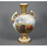 A Royal Worcester two-handled baluster vase with gilded neck and foot, painted with Highland