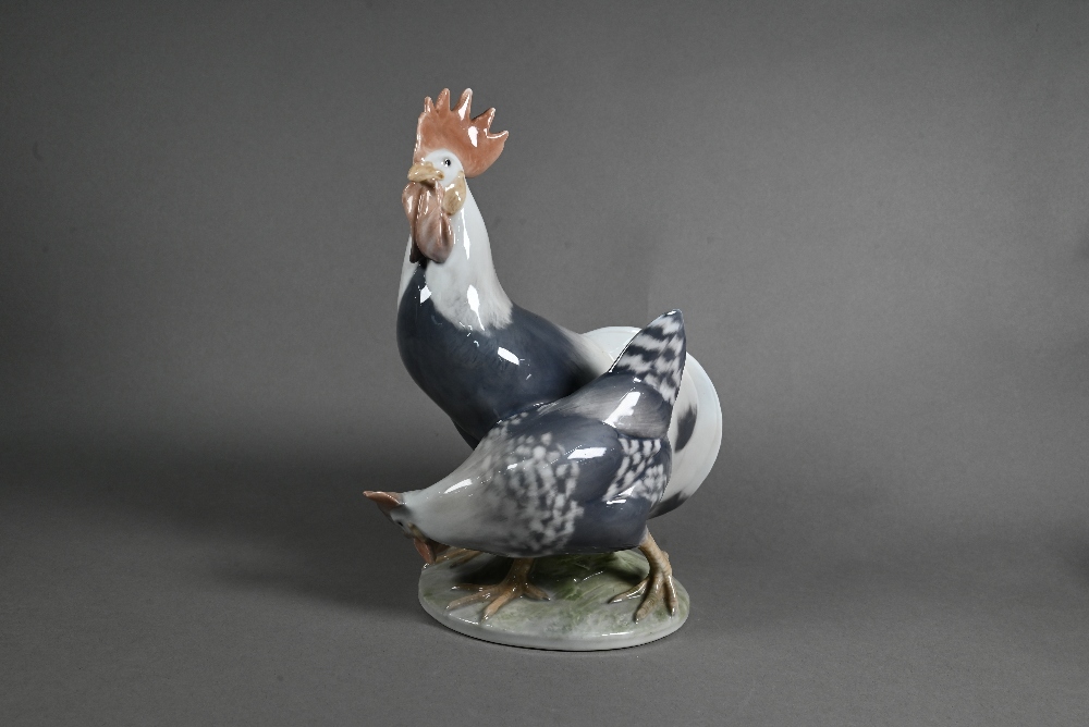A Royal Copenhagen group, Cockerel and Hen 1094, 24 cm, to/w two small roosters 1126/27 and a blue - Image 2 of 11