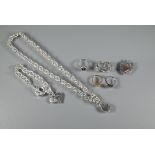 Mixed silver and white metal jewellery including rings, pair of hoop earrings and curb bracelets and