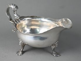 Heavy quality sauce boat in the Georgian manner, with scale-moulded scroll handle and three shell