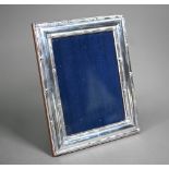 A modern Britannia standard silver photograph frame on wooden back, Ray Hall, Birmingham (no