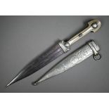 An Eastern dagger, the twin fullered 18 cm blade with horn panelled grip, in white metal scabbard