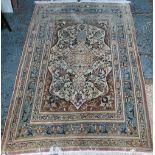 An old Persian Tabriz rug, camel ground, 168 cm x 114 cm