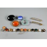 A collection of antique jewellery items including turquoise bead set circlet brooch, oval banded