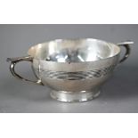 An Arts & Crafts two-handled silver bowl with reeded band and plain foot-rim, E.S. Barnsley & Co,