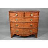 A Victorian mahogany bowfront chest of two short over three long graduated drawers, raised on shaped
