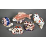 Two Royal Crown Derby figures, snail and Fish, to/w three paperweights with silver plugs: Frog, Seal
