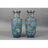 A pair of 19th century Chinese cloisonne on brass rouleau vases decorated in polychrome enamels with