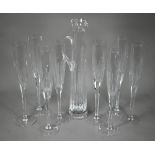 A set of seven Thomas Goode large glass champagne flutes, 40 cm high, to/w a similar tall and