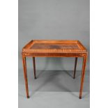 A Sheraton period inlaid tray top satinwood silver table, with slide to each side, raised on