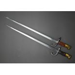 Two 19th century French sabre bayonets, with 52 cm steel blades, marked St Etienne 1877/78 (no