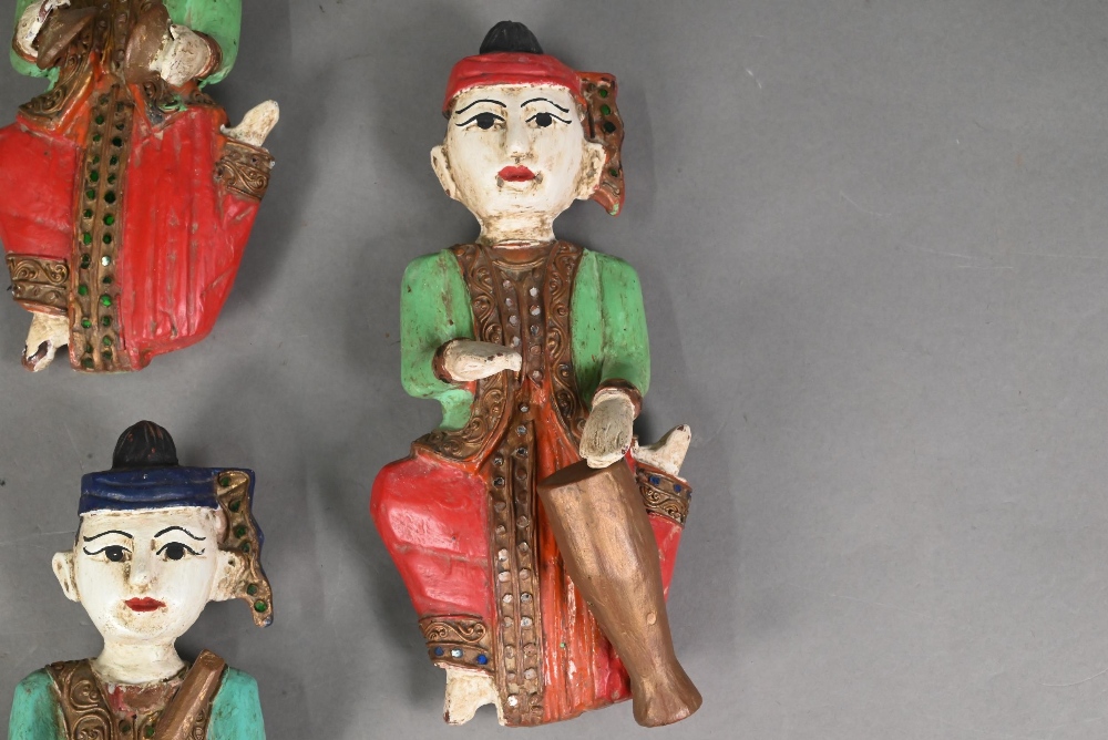 A set of seven vintage polychrome Burmese temple musician wall plaques, carved hardwood with - Image 5 of 9