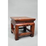 An antique Chinese elm stand, 31 cm x 31 cm x 30 cm h