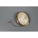 An oval cameo brooch featuring bust of a young female, in yellow metal oval mount with rope twist