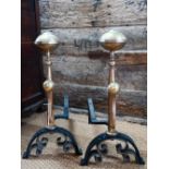 A large pair of antique brass and iron fire dogs, 55 cm h (later alterations)