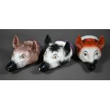 Two early 19th century Pratt-type pottery fox's head stirrup cups with pink lustre collars, to/w a