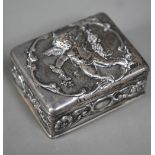 An Edwardian silver trinket box and cover, embossed with cherubs, Goldsmiths and Silversmiths Co